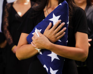Flag held to heart